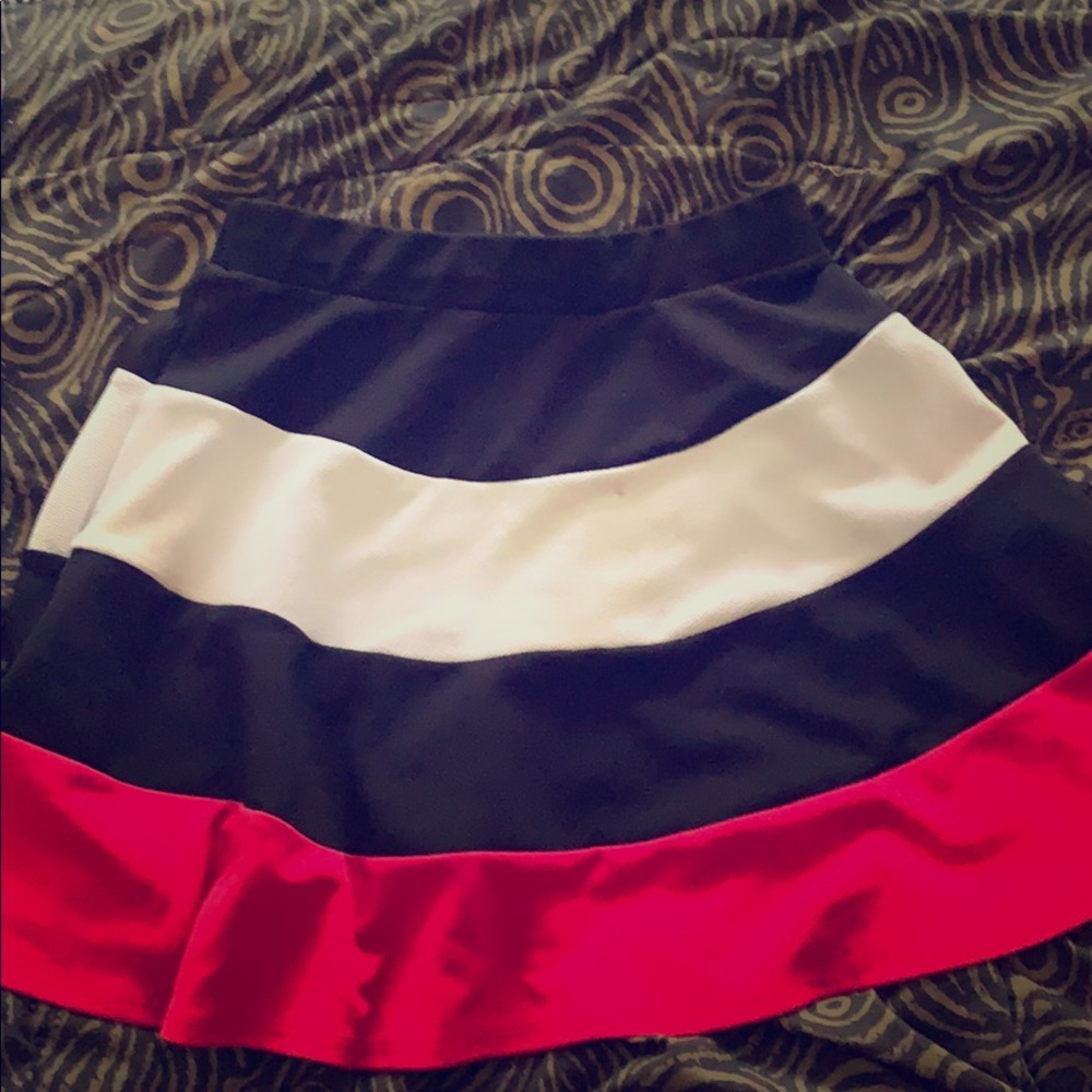 Pink black and white skirt.